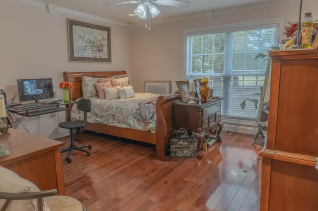 a bedroom with furniture and a window