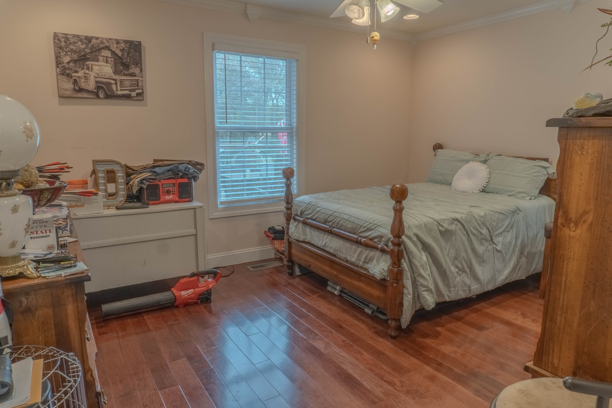 979 State Line Road Five Points, TN 38457 - Photo 20 of 23 a bedroom with a bed and a chandelier