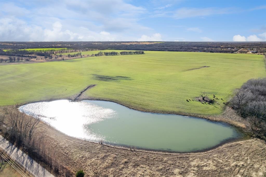 a view of a swimming pool with a lake