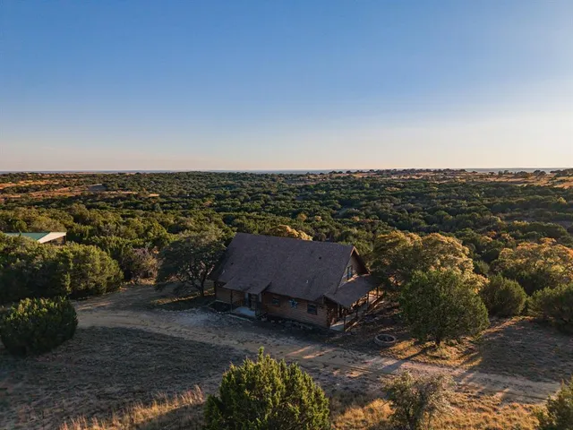 a view of house with yard and entertaining space
