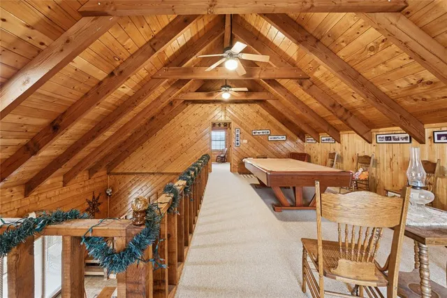 a backyard of a building with barbeque oven table and chairs