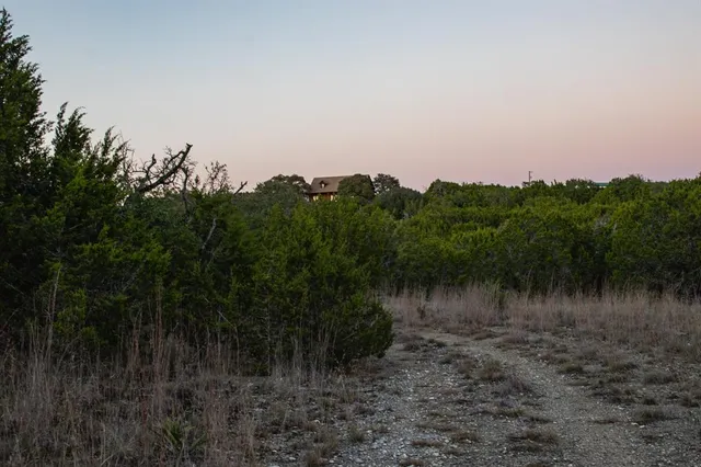 a view of a lake with sunset