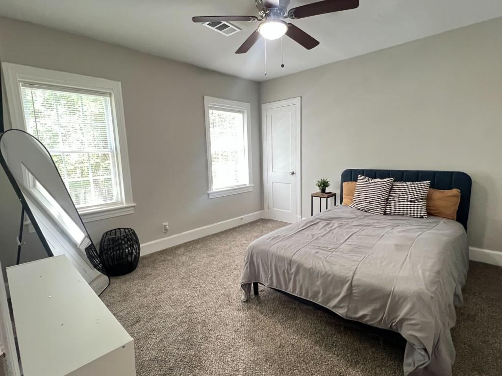1076 Carlisle Avenue Macon, GA 31204 - Photo 11 of 16 a bedroom with a bed and window