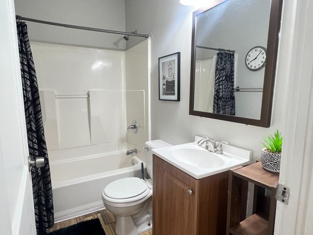 1076 Carlisle Avenue Macon, GA 31204 - Photo 16 of 16 a bathroom with a sink toilet and shower
