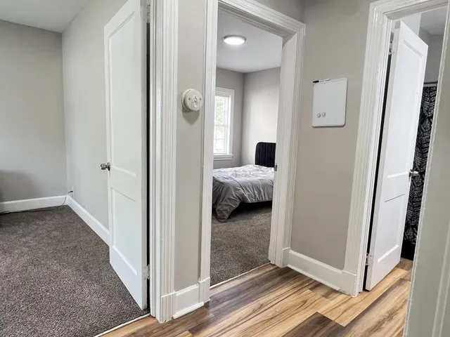 a view of a bedroom from a hallway