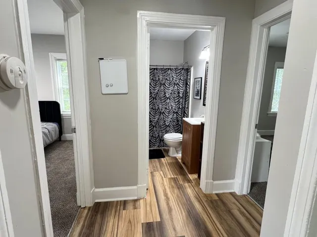 a bedroom with a bed and window