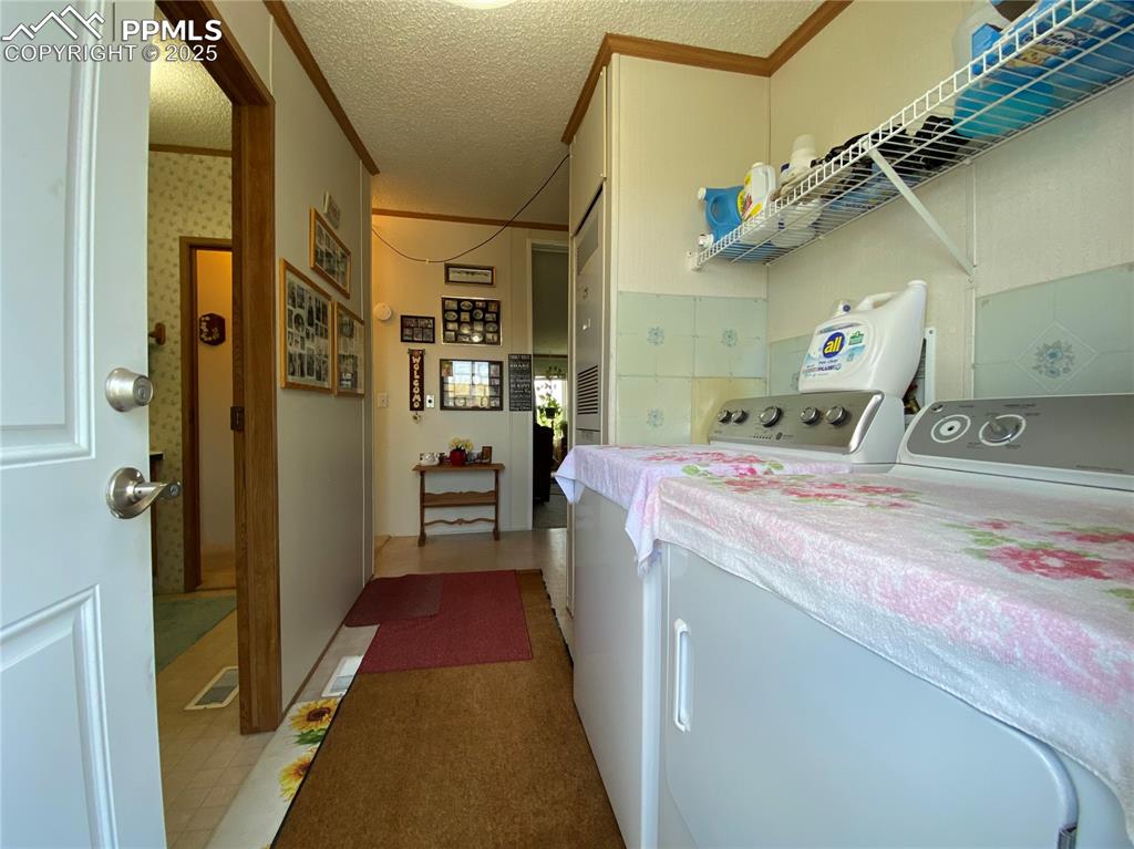 3955 South Meridian Road Colorado Springs, CO 80929 - Photo 20 of 39 a utility room with dryer and washer