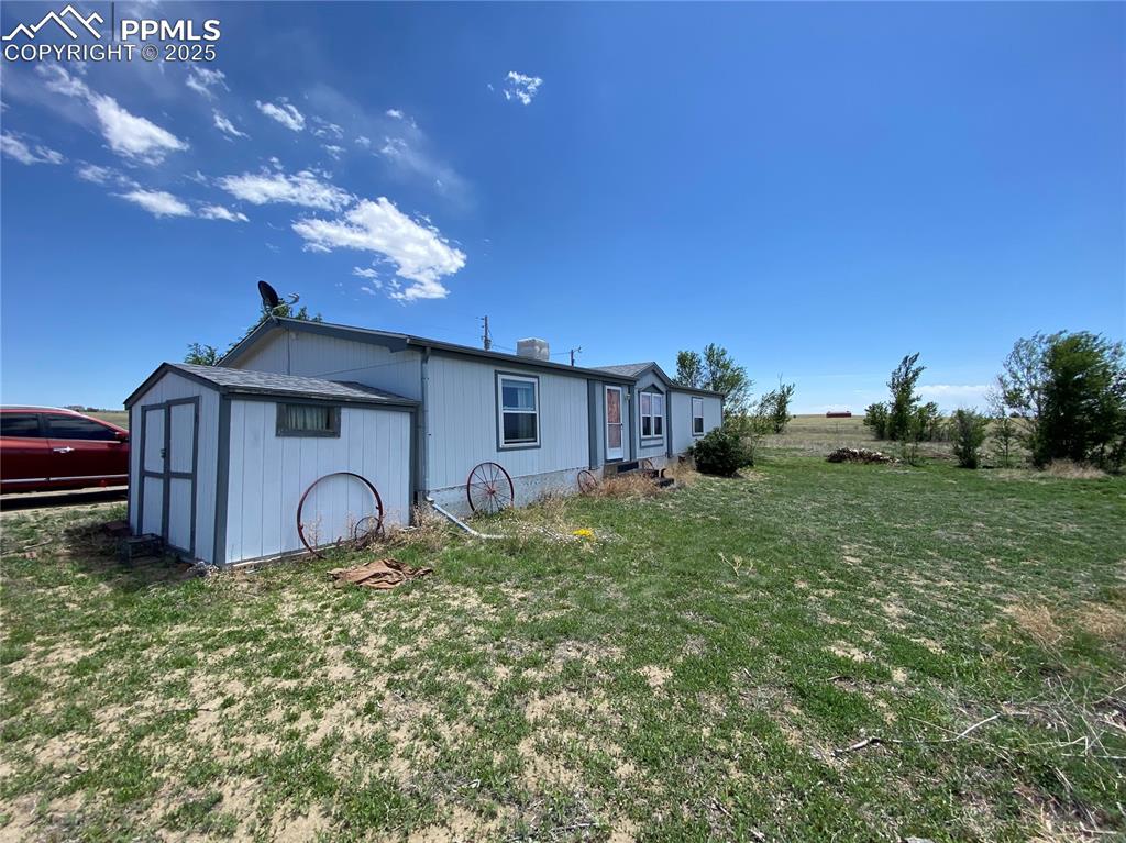 3955 South Meridian Road Colorado Springs, CO 80929 - Photo 22 of 39 a front view of a house with garden