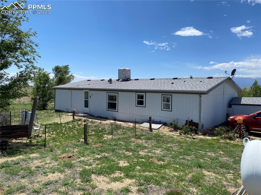 3955 South Meridian Road Colorado Springs, CO 80929 - Photo 23 of 39 a view of a house with yard and a tree