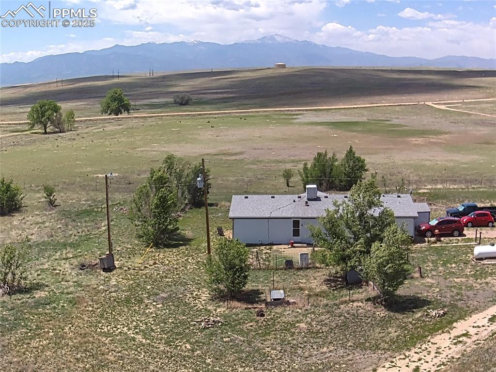 3955 South Meridian Road Colorado Springs, CO 80929 - Photo 25 of 39 a view of a lake with a mountain in the background