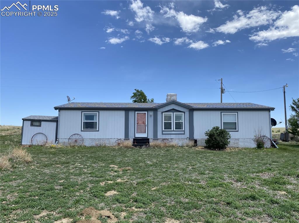 3955 South Meridian Road Colorado Springs, CO 80929 - Photo 27 of 39 a front view of a house with garden