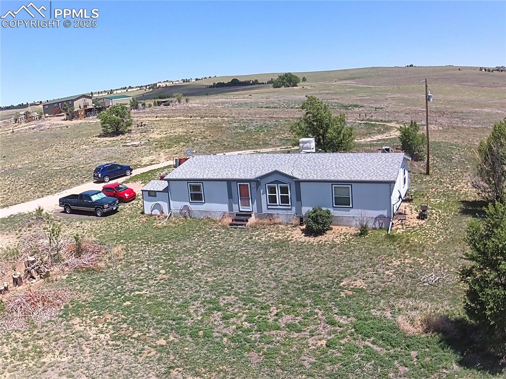 3955 South Meridian Road Colorado Springs, CO 80929 - Photo 28 of 39 a front view of a house with a yard