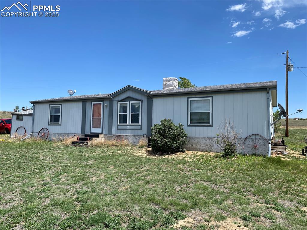 3955 South Meridian Road Colorado Springs, CO 80929 - Photo 29 of 39 a backyard of a house with table and chairs