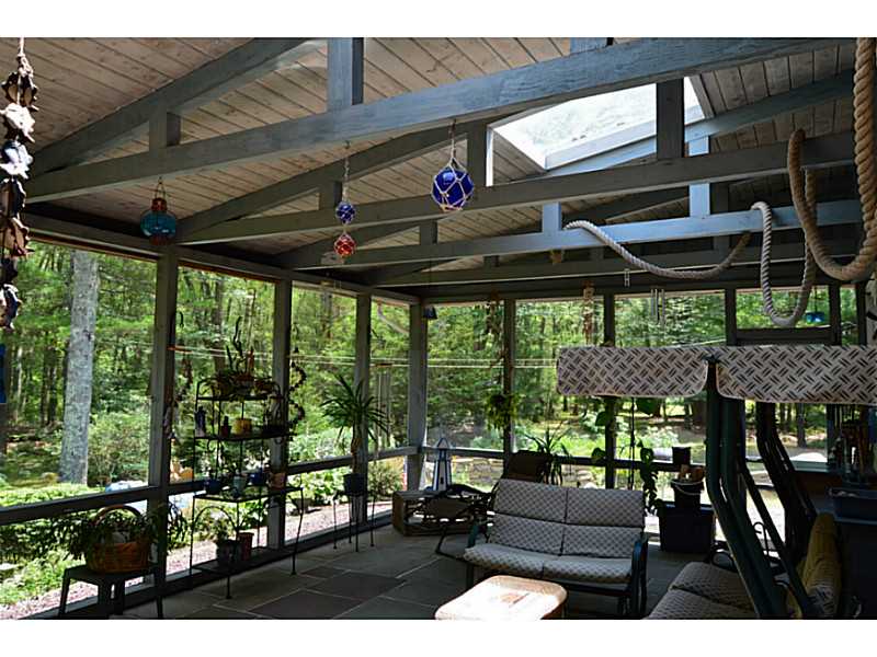270 Biscuit City Road Charlestown, RI 02813 - Photo 8 of 25 Porch. AWESOME, HUGE screened in room with stone floor! absolutely amazing!