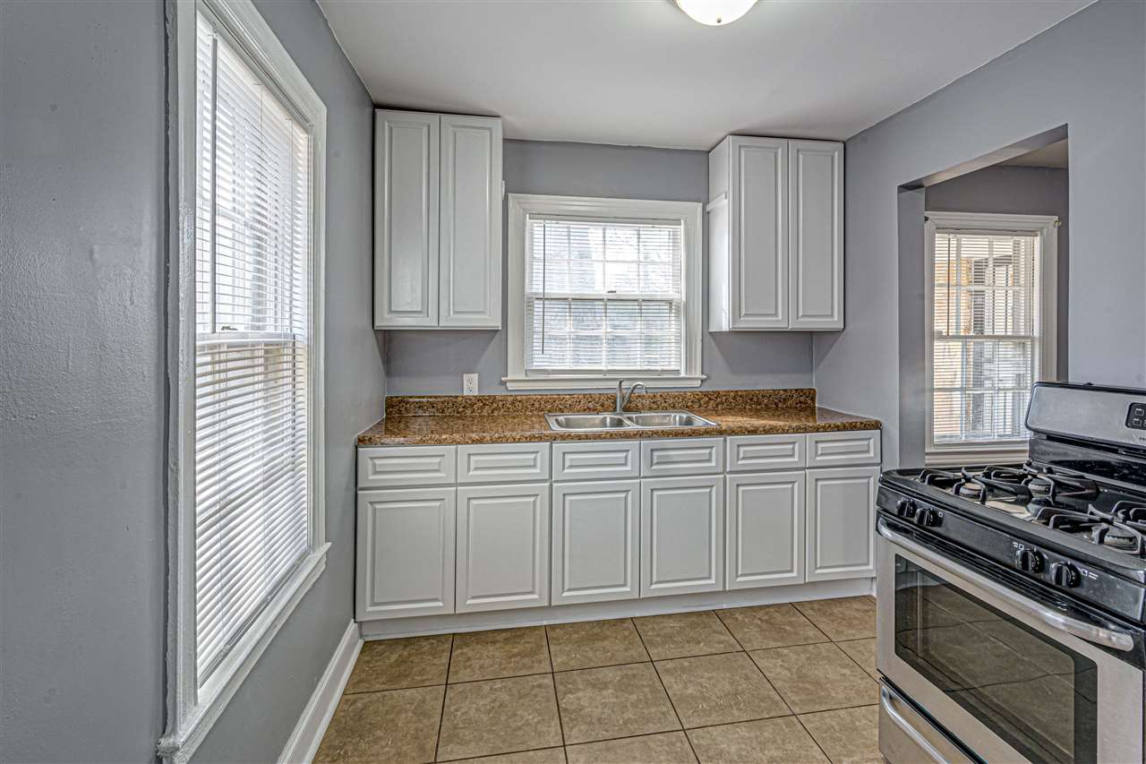 Cozy kitchen has stainless steel gas stove installed and there's room beside it for a small refrigerator. Tall cabinets for food & storage.  Large 16"x16" durable tiles floors + a friends entry to bring in groceries.