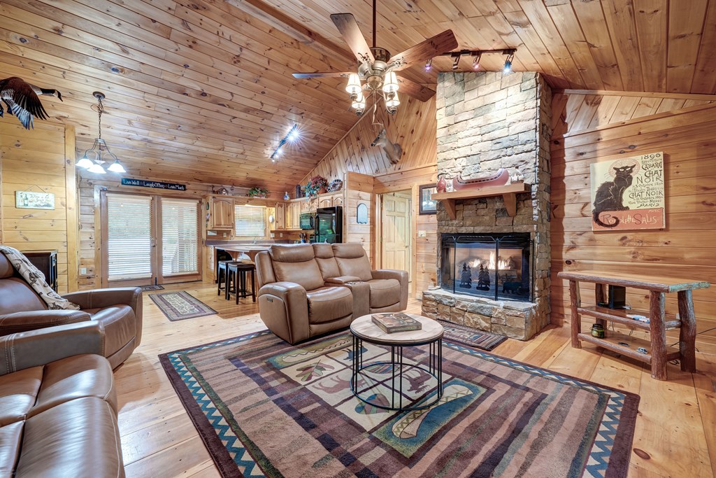 30 The Forest Road Blue Ridge, GA 30513 - Photo 12 of 47 a living room with furniture and a fireplace