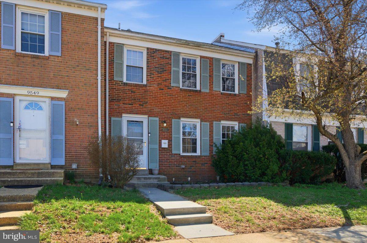 9551 Covington Place Manassas, VA 20109 - Photo 1 of 24 a front view of a house with garden