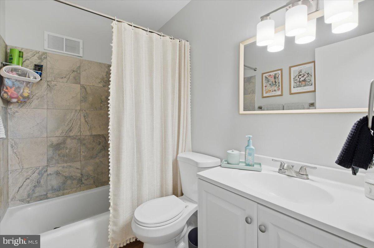 9551 Covington Place Manassas, VA 20109 - Photo 18 of 24 a bathroom with a sink toilet and shower