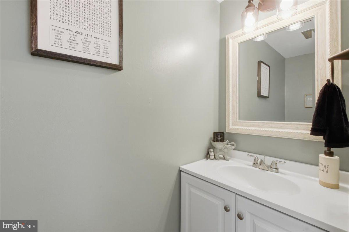 9551 Covington Place Manassas, VA 20109 - Photo 19 of 24 a bathroom with a sink and a mirror