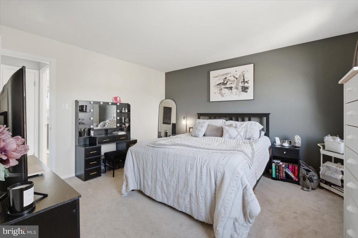 9551 Covington Place Manassas, VA 20109 - Photo 21 of 24 a bedroom with a bed furniture and a flat screen tv