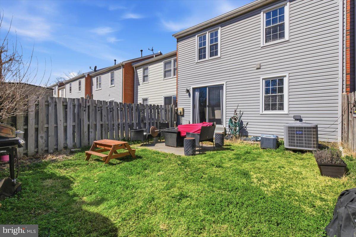 9551 Covington Place Manassas, VA 20109 - Photo 24 of 24 a view of a house with backyard and sitting area