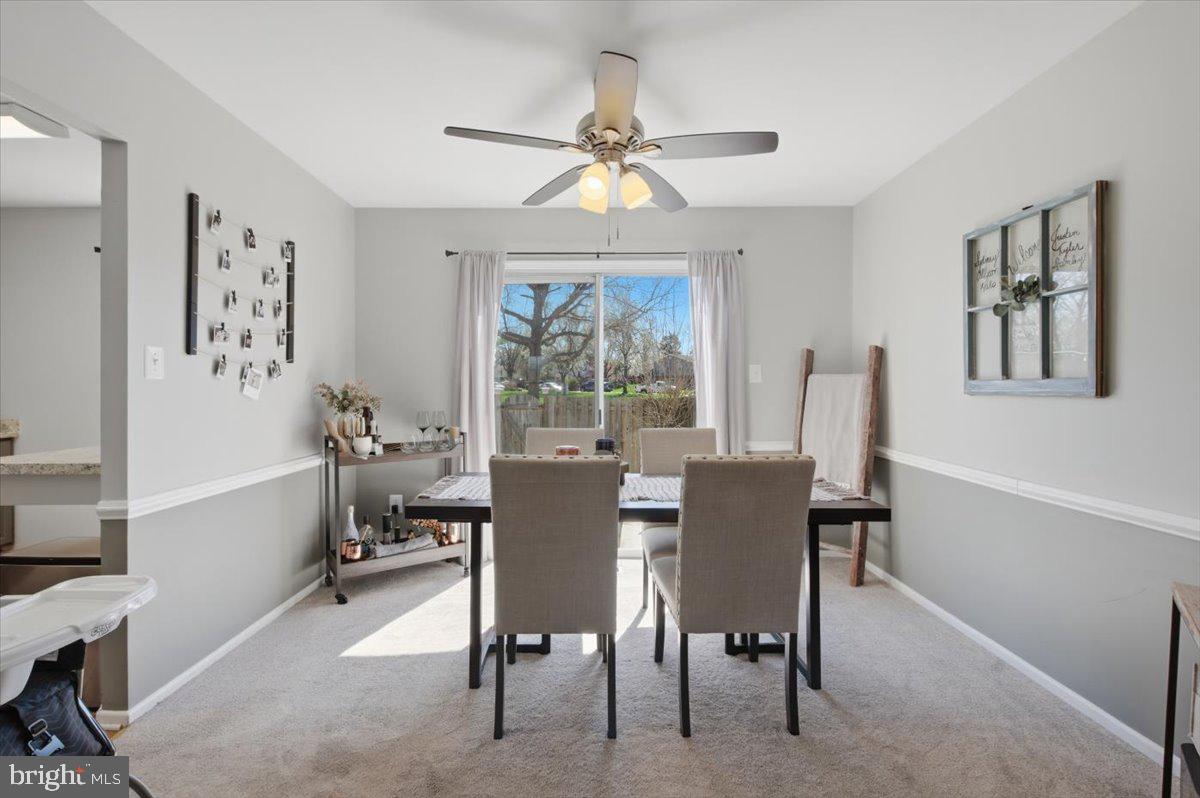 9551 Covington Place Manassas, VA 20109 - Photo 9 of 24 a dining room with furniture a chandelier and window
