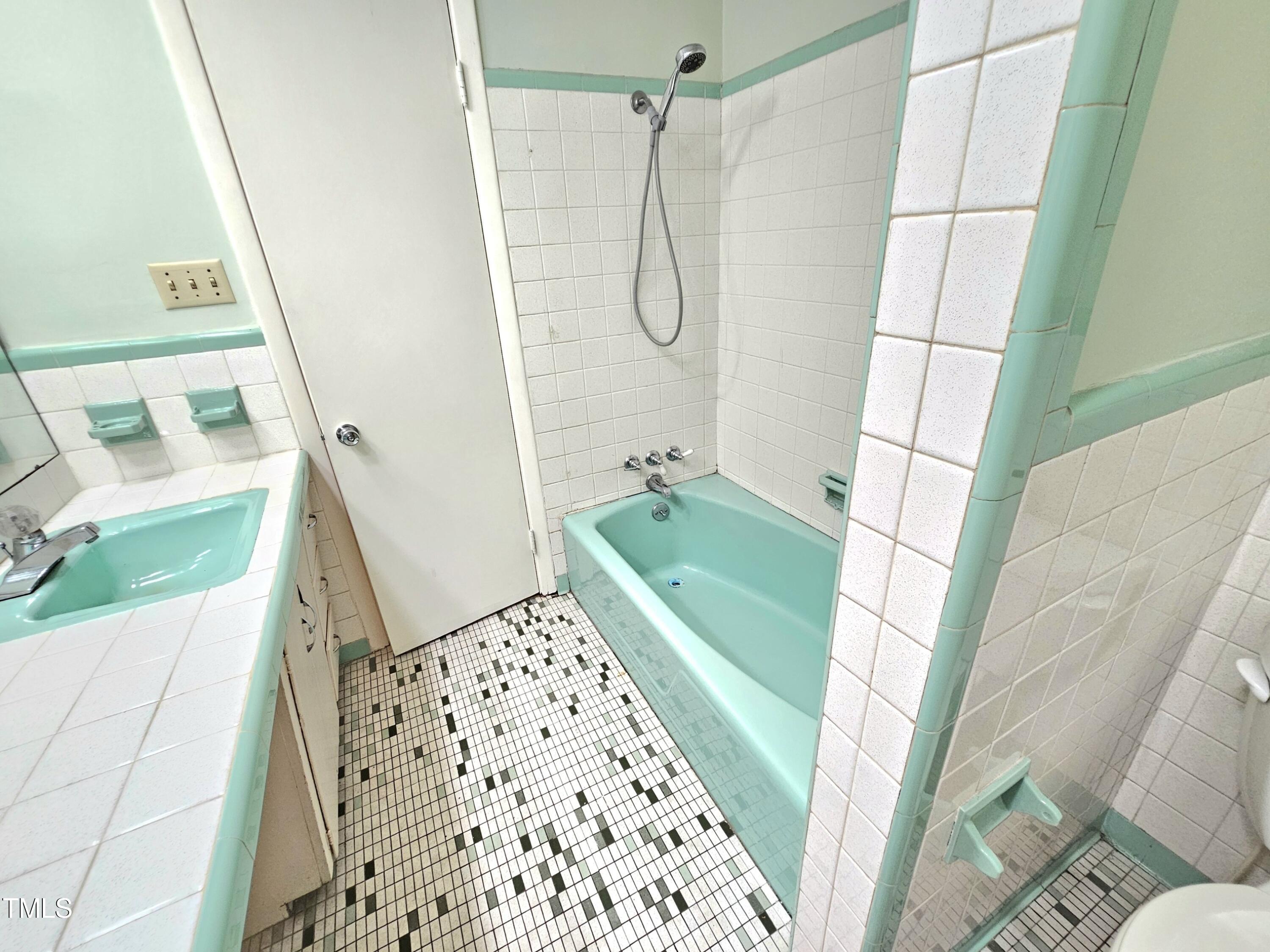 400 Harrill Circle Spring Lake, NC 28390 - Photo 14 of 25 a bathroom with a sink and a shower