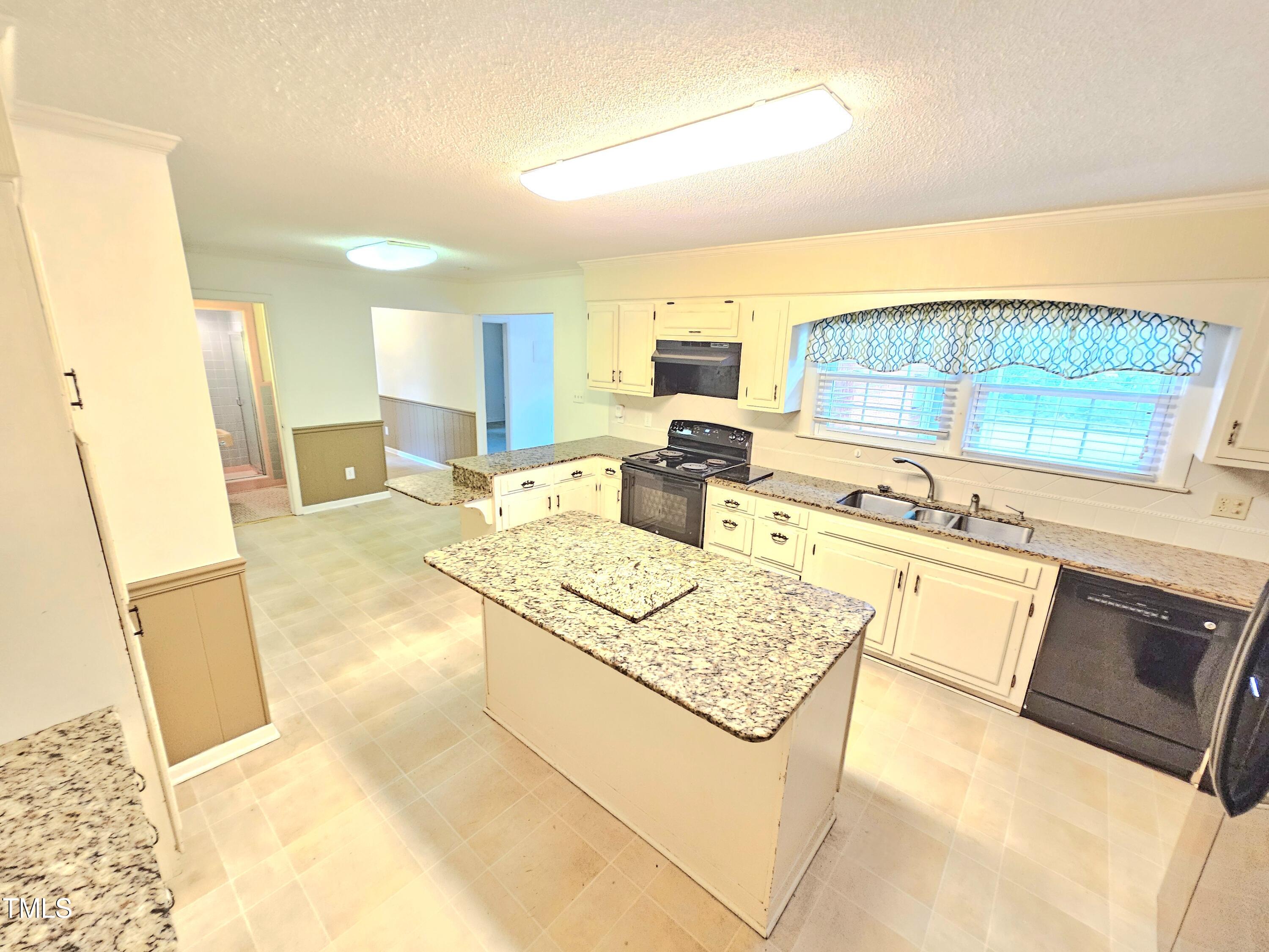 400 Harrill Circle Spring Lake, NC 28390 - Photo 22 of 25 a open kitchen with stainless steel appliances granite countertop a sink stove and cabinets