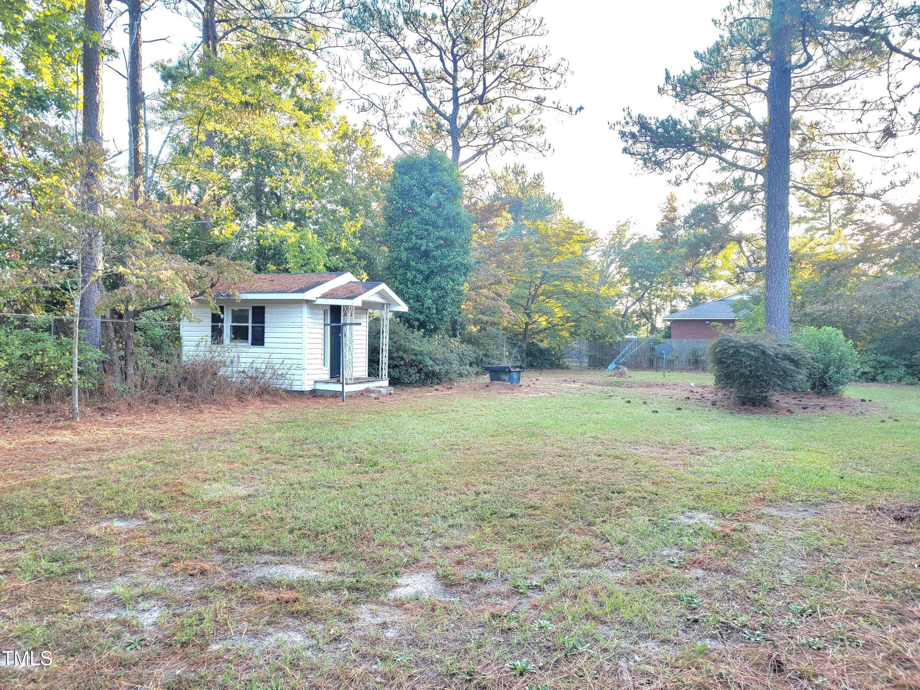 400 Harrill Circle Spring Lake, NC 28390 - Photo 25 of 25 a view of a house with backyard and a tree