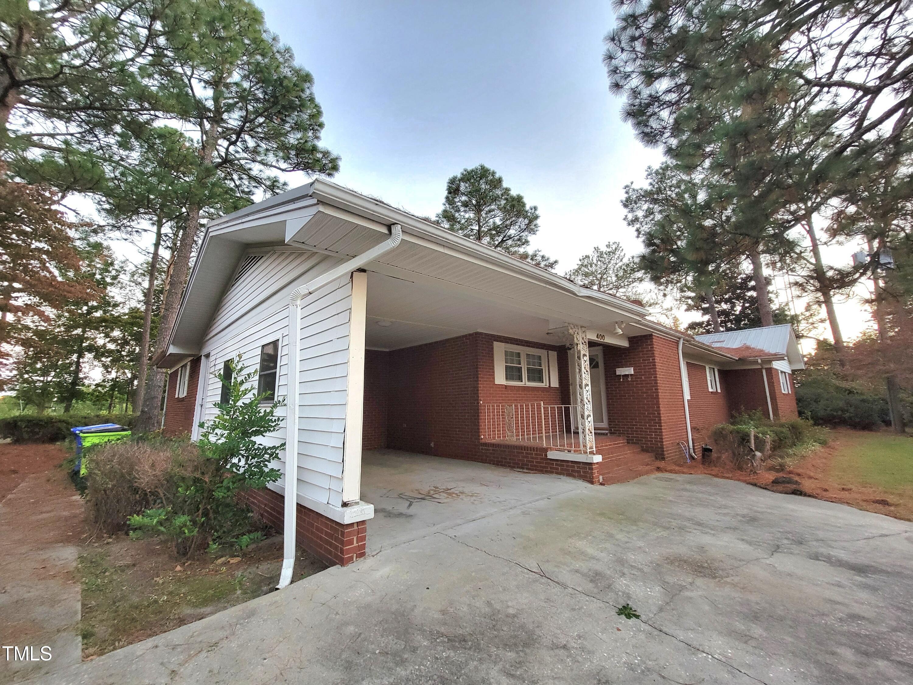 400 Harrill Circle Spring Lake, NC 28390 - Photo 3 of 25 a view of a house with a yard and garage