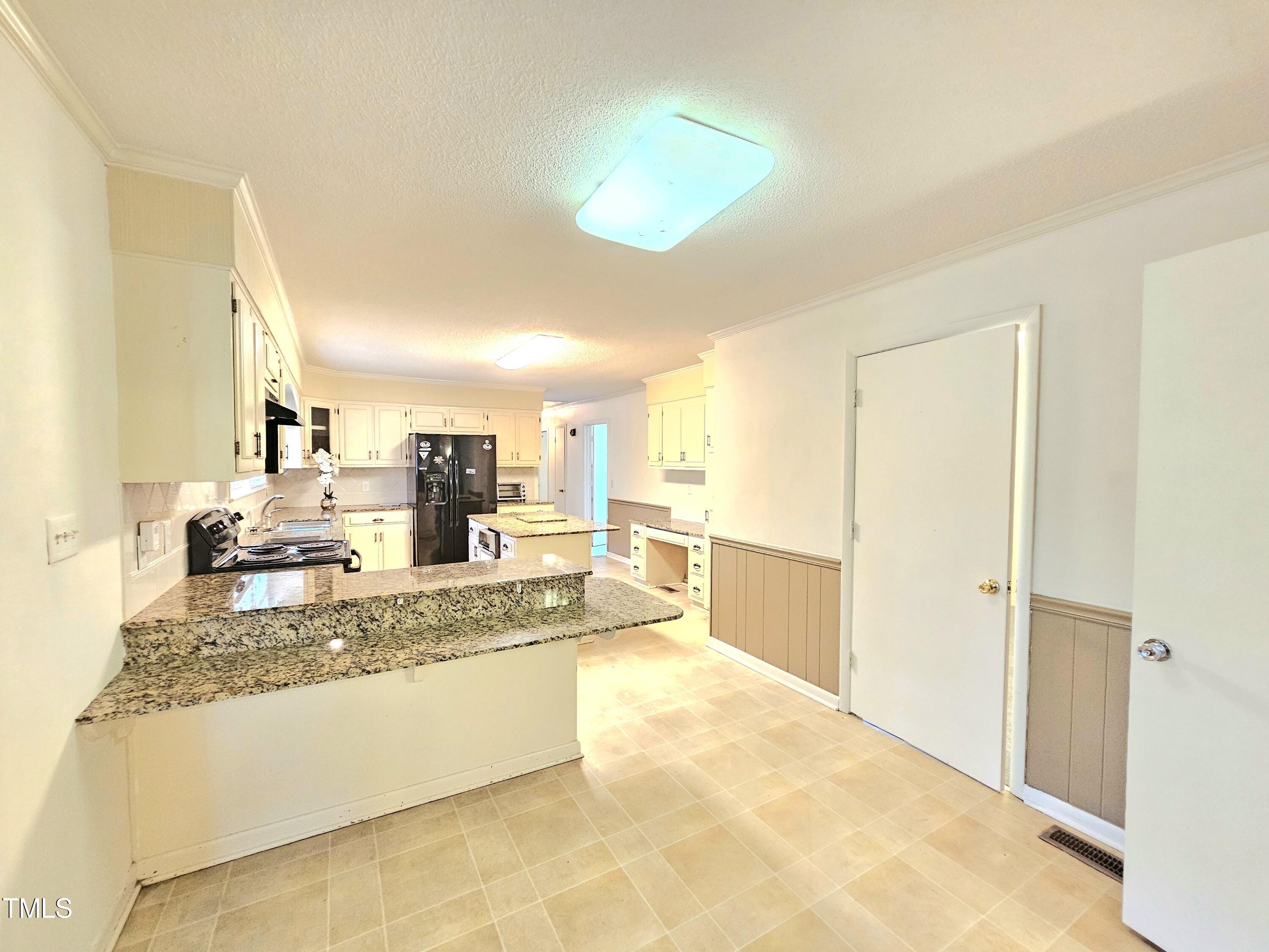 400 Harrill Circle Spring Lake, NC 28390 - Photo 6 of 25 a large bathroom with a granite countertop double vanity sink and a mirror