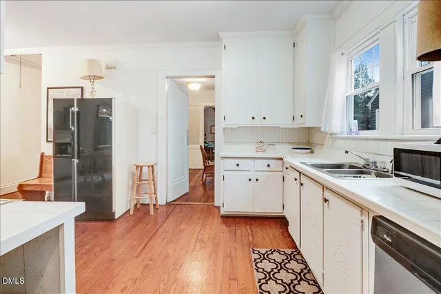 a view of a kitchen cabinets and wooden floor