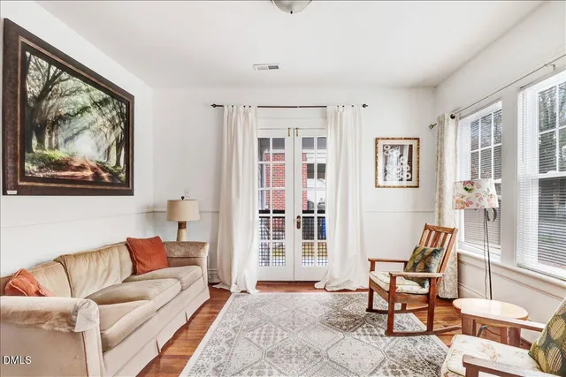 a bathroom with a sink toilet and window
