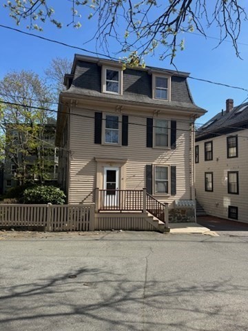 15 Harris Street, Unit 2 Marblehead, MA 01945 - Photo 9 of 12 a front view of a house with iron fence