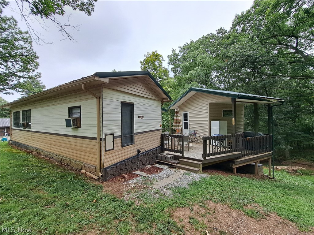 17875 Lashley Road, Unit 124 Senecaville, OH 43780 - Photo 11 of 45 Back of property featuring a yard, and a deck.