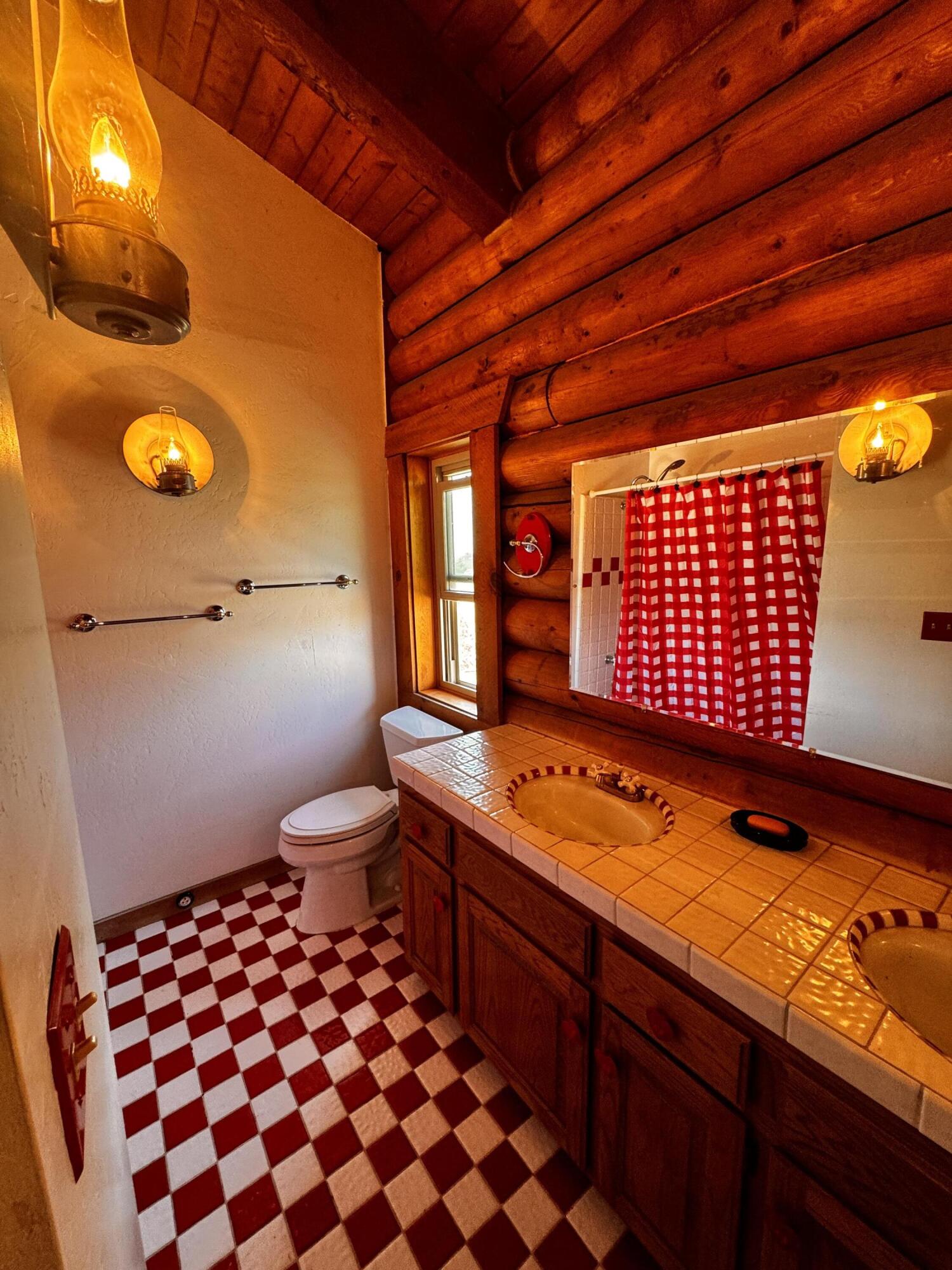 30723 Hamilton Drive Exeter, CA 93221 - Photo 26 of 85 a bathroom with a sink a toilet and shower
