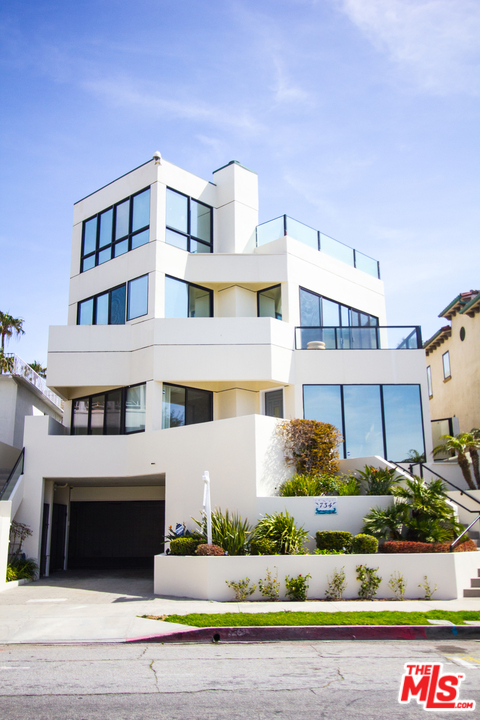 734 Esplanade, Unit A/B Redondo Beach, CA 90277 - Photo 1 of 40 a front view of a building with lots of plants and seating area
