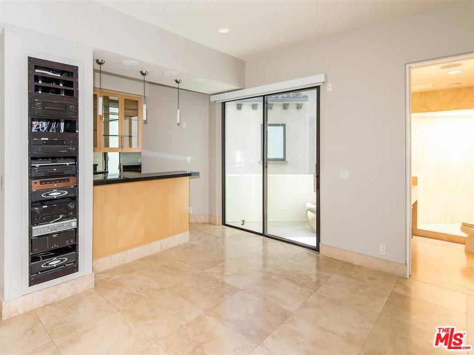 734 Esplanade, Unit A/B Redondo Beach, CA 90277 - Photo 13 of 40 an empty room with kitchen view and a window