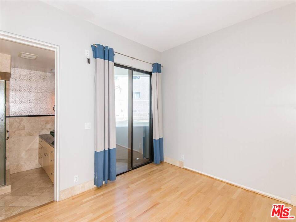 734 Esplanade, Unit A/B Redondo Beach, CA 90277 - Photo 15 of 40 a view of a room with wooden floor and a bathroom