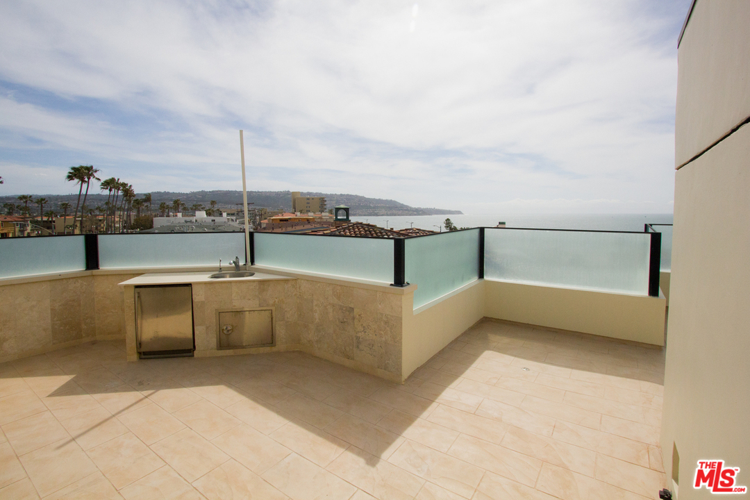 734 Esplanade, Unit A/B Redondo Beach, CA 90277 - Photo 18 of 40 a terrace with outdoor seating and city view