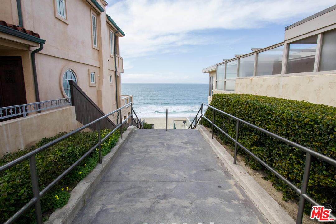 734 Esplanade, Unit A/B Redondo Beach, CA 90277 - Photo 39 of 40 a view of a balcony with wooden floor and a potted plant