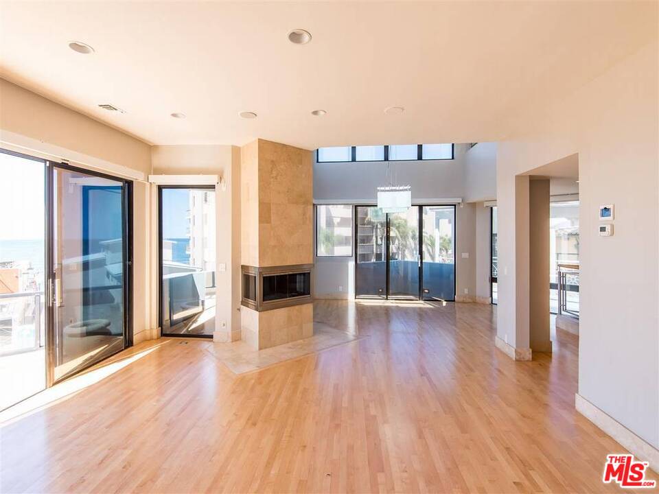 734 Esplanade, Unit A/B Redondo Beach, CA 90277 - Photo 5 of 40 a view of a living room hardwood floor and a kitchen