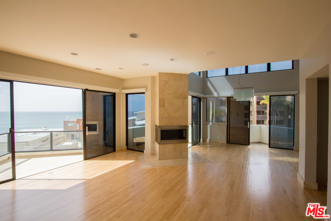734 Esplanade, Unit A/B Redondo Beach, CA 90277 - Photo 7 of 40 a view of a hallway with wooden floor and a kitchen