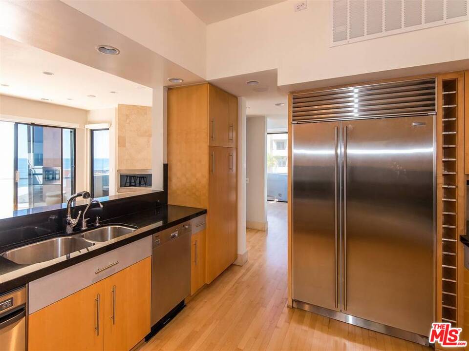 734 Esplanade, Unit A/B Redondo Beach, CA 90277 - Photo 10 of 40 a kitchen with granite countertop a sink and cabinets
