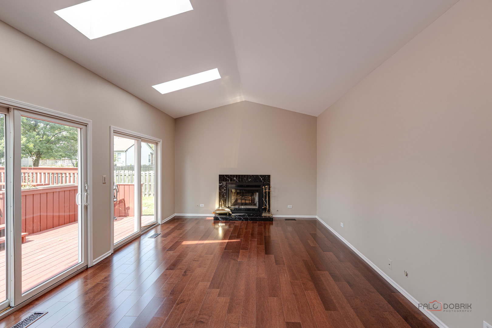 285 Stanton Drive Buffalo Grove, IL 60089 - Photo 12 of 36 a view of empty room with wooden floor and fireplace