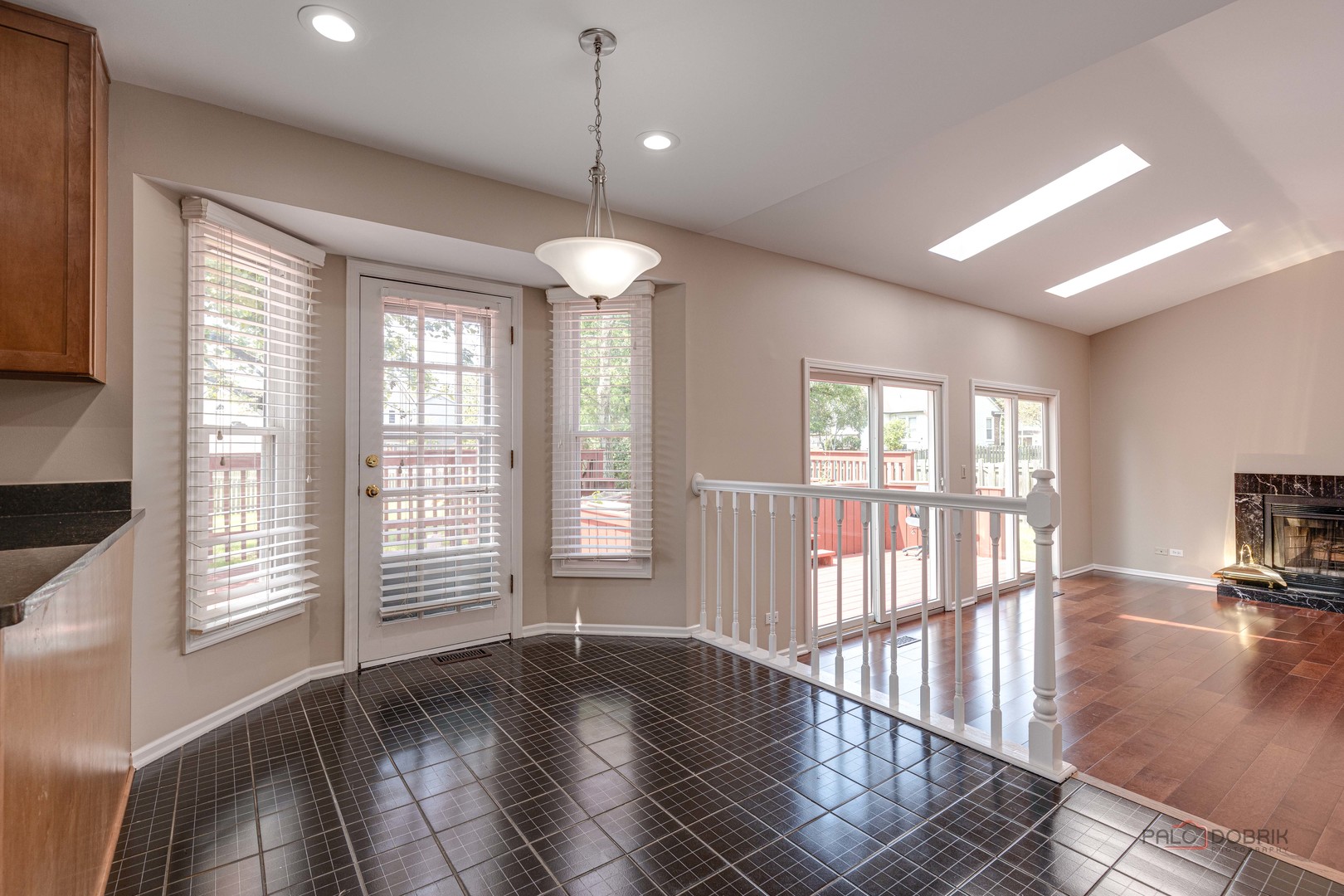285 Stanton Drive Buffalo Grove, IL 60089 - Photo 18 of 36 a view of an empty room with wooden floor and a window