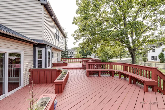 a view of balcony with deck wooden floor and outdoor seating