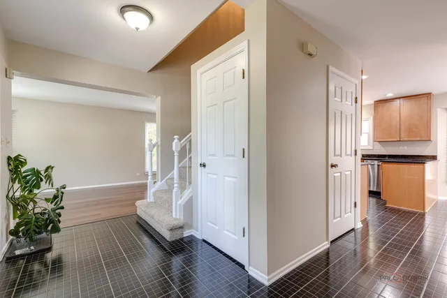 a view of a hallway view with wooden floor and staircase