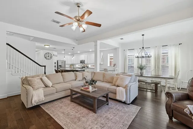 a bathroom with a sink and mirror with shower