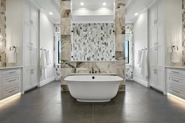a spacious bathroom with a bathtub and shower